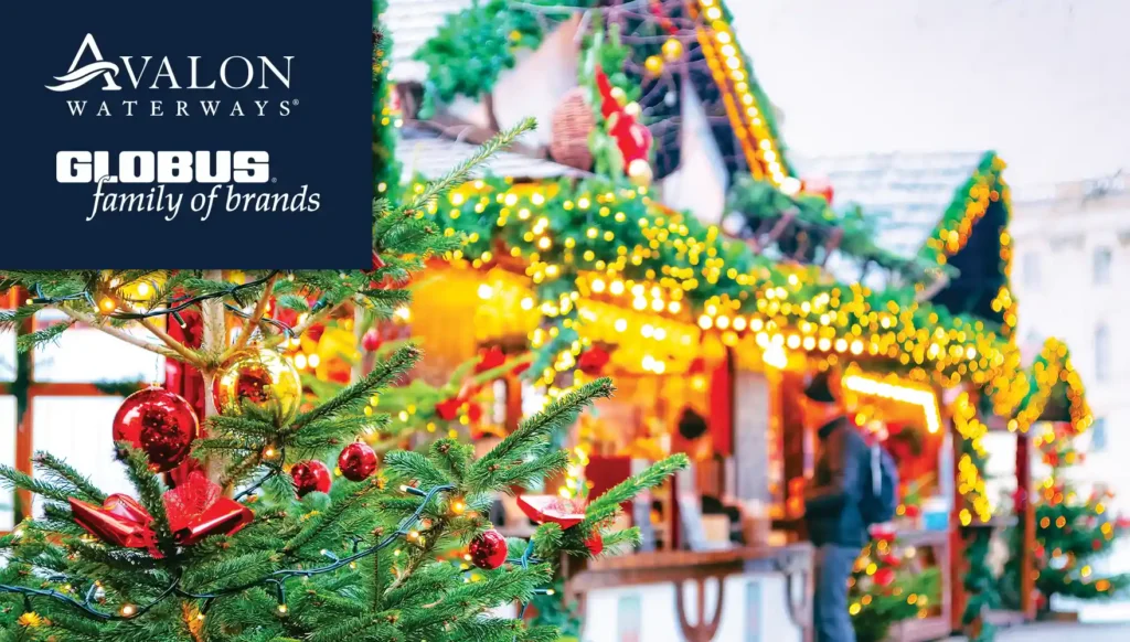 Photo of a sparse Christmas tree with Christmas market stalls in the background