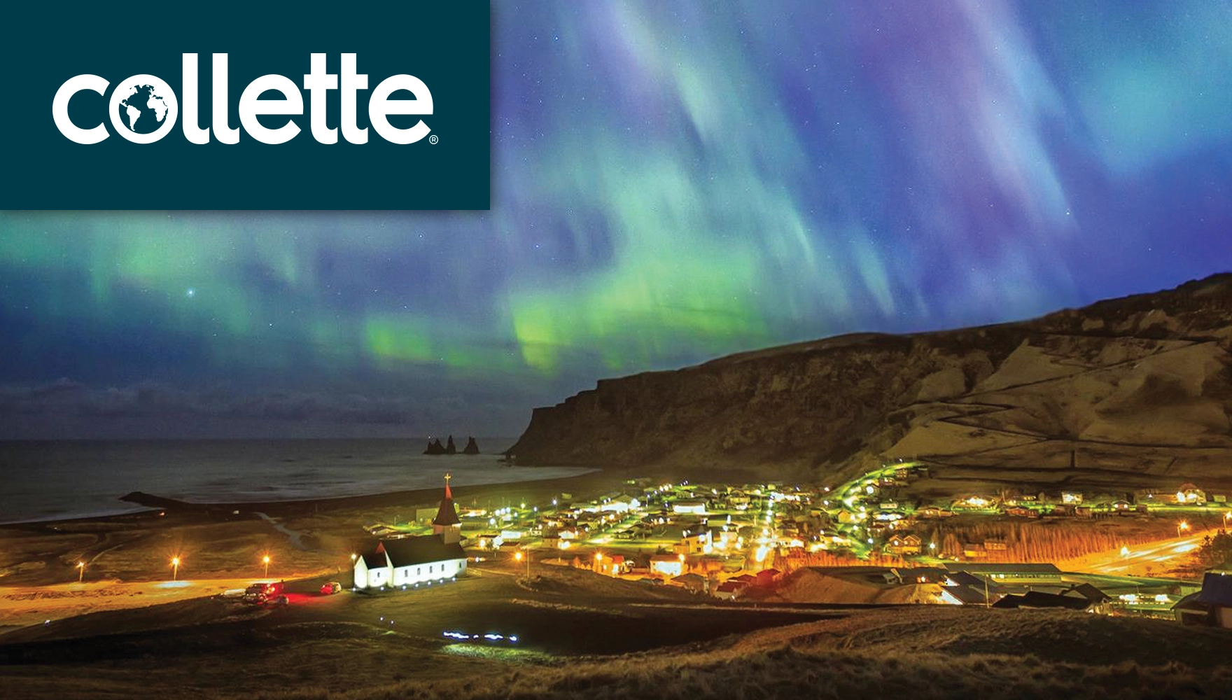 Photo of the aurora borealis (northern lights) over a town in Iceland
