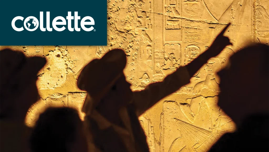 Photo of someone pointing to Egyptian hieroglyphics