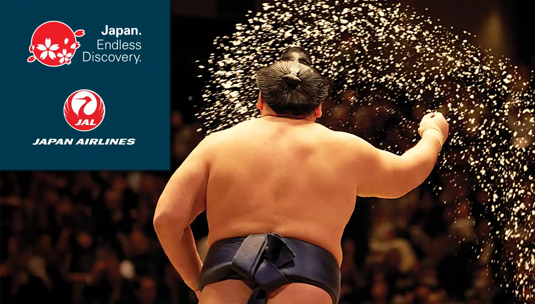 Photo of a Sumo Wrestler throwing salt in the ring before a match
