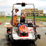 Melissa Chang harvesting rice in Niigata Prefecture.