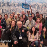 2025 Fall Tokyo Explorer Tour group photo at Tokyo Tower.