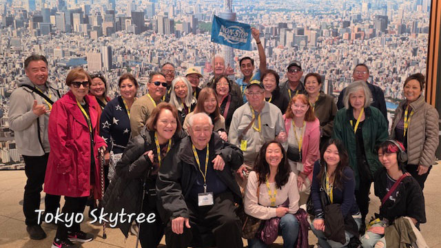 2025 Fall Tokyo Explorer Tour group photo at Tokyo Tower.