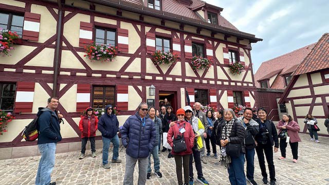 2025 Heart of Europe Tour with Oktoberfest, photo of the group at Nuremberg Castle, Germany.